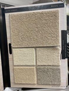 the front of a store display with four different shades of carpet on it's sides