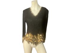 "Vintage bead and sequin top, tag says Lauence Kazar, sz L, 100% silk. Top zips up the back, has shoulder pads, V neck, comes to points at the bottom. Top is in great condition, measurements are shoulder to shoulder 16\" bust up to 36\" waist up to 30\" length 23\" sleeve length 22\"" Glamorous Embellished Gold Tops, Glamorous Gold Embellished Top, Embellished V-neck Party Top, Embellished Tops For Holiday Night Out, Embellished V-neck Top For Party, Embellished Tops For Night Out And Holiday, V-neck Sequin Blouse For Evening, Gold Embellished Evening Blouse, Fitted Gold Sequin Top