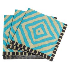 three blue and black napkins on top of each other with an abstract design in the middle