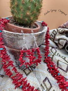 This natural red coral necklace is handmade by me.  The outer strand of red coral has sterling silver spacer beads and the inner strand has turquoise chips for its spacer beads.  It is a 24 inch necklace with a beautiful sterling silver clasp.  A turquoise stone pendant and matching coral earrings are included with purchase.   The earrings are also natural red coral and sterling silver.    Visit MyStylCraft` for a unique shopping experience!  Thanks, Linda Gray Linda Gray, Red Coral Necklace, Coral Beads Necklace, Red Feather, Hippie Necklace, Coral Earrings, Coral Necklace, Coral Beads, Red Coral