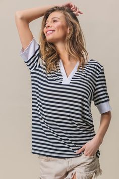 The Contrast Striped Notched Knit Top is a chic and versatile piece that combines classic stripes with a modern twist. The stripes create a visually appealing effect, while the notched detail adds a stylish and contemporary element. Pair this top with tailored pants for a polished outfit, or with jeans for a casual yet put-together ensemble. Features: Basic style Stretch: No stretch Material composition: 100% polyester Imported Trending Tops, Notched Neckline, Tailored Pants, Basic Style, Striped Knit, Hoodie Top, Bottoms Pants, Jacket Dress, Outfit Sets