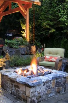 a fire pit in the middle of a patio