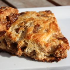 two biscuits sitting on top of a white plate