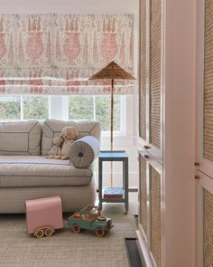 a living room filled with furniture and toys