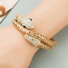 Material: Environmental Alloy, Rhinestone Color: Golden Dimensions: 7 Cm Weight: Approx. 50 G Gold Alloy Crystal Bracelet For Party, Trendy Gold Metal Crystal Bracelet, Trendy Gold Crystal Bracelet, Serpent Bracelet, Golden Snake, Sophisticated Jewelry, Snake Bracelet, Snake Design, Coils