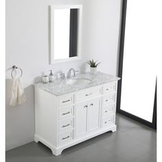 a bathroom vanity with two sinks and a mirror