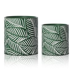 two green vases sitting next to each other