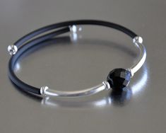 "These bracelets are super easy to wear, you hardly notice they are on. They are made with black rubber tubing, silver plated tube beads and different  10 mm accent beads. The inside wire is \"memory wire\", so the bracelet can be adjusted slightly to better fit your wrist. Just squeeze the sides slightly, or open up a bit,  to fit more or less snug. The bracelets will fit most sizes. If you have any questions about the sizing, please convo me for more detail." Jewelry Layering Bracelets, Scripture Jewelry, Turquoise Wrap Bracelet, Beads Tutorial, Paw Print Bracelet, Flower Girl Bracelets, Dainty Gold Bracelet, Bracelet Quotes, Boho Wrap Bracelet