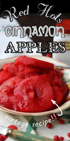 a bowl filled with red apples on top of a table