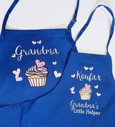 two blue aprons with cupcake designs on them