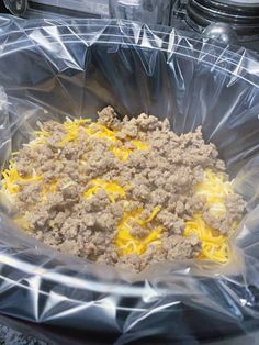 a plastic bag filled with food sitting on top of a counter