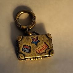 This Was In My Last Order,Never Used Just Stored New Old Stock.Im Not Sure When It Was Made,But It's Very Cool ,With Fossil Great Quality. Made Of Brass,I Think With Enamel Inlays.It Has A Postcard Attached By A Chain That Is Stored Inside Or Can Dangle Outside.Attach To Fossil Charm Bracelets Or Your Keys Or Backpack Usa Jewelry, Fossil Jewelry, Custom Charms, Raw Brass, Alchemy, My Last, Charm Bracelets, Fossil, Charm Bracelet