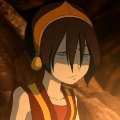 an anime character with black hair and brown eyes standing in front of a rock formation