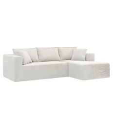 a white couch with pillows on it