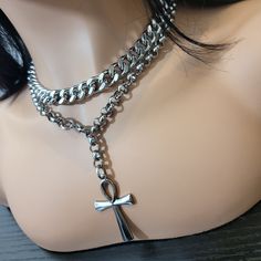 Unleash the power of the Ankh with this stunning stainless steel necklace! Elevate your style and energy with the ancient Egyptian symbol of life and immortality. This piece is a must-have for any spiritual warrior, fashionista, or both. Order yours today and feel the power of the Ankh! - Double stainless steel collar. - Ankh in stainless steel. - Variable length, please select your size. Thank you for visiting my shop and I hope you enjoy your necklace! Please do not hesitate to contact me with any questions and/or concerns! Steel Collar, Stainless Steel Collar, Ancient Egyptian Symbols, Symbol Of Life, Spiritual Warrior, Double Necklace, Egyptian Symbols, Life Symbol, Alt Fashion