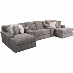 a large sectional couch with pillows on the top and bottom corner, in grey fabric