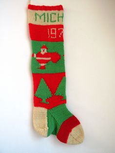 a red and green sock with an airplane on it