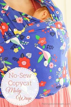 a close up of a woman wearing a baby in a blue floral print wrap with the words, no sew copycat may wrap