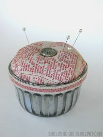 a cupcake tin with buttons in it