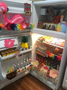 an open refrigerator filled with lots of food and condiments on top of it