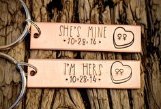 two keychains that say she's mine and i'm her