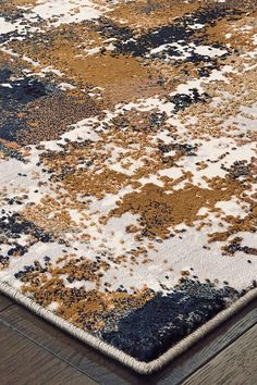 an area rug with brown, blue and white colors