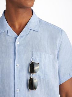 The Monaco short sleeve shirt features a curved back yoke with a box-pleat for comfort and a curved hem with side vents for ease of movement. We've used the classic styling of a button-through front and cuffs, a 2-piece collar and for a modern addition, we've added a U-shaped breast pocket with a handy sunglass loop for effortless summer chic. For a final touch of luxe, the shirt is finished with mother of pearl buttons throughout and our minimalist rose logo label at the hem. There's also a han Washed Blue Short Sleeve Shirt With Button Closure, Blue Linen Button-up Short Sleeve Shirt, Blue Technical Short Sleeve T-shirt, Luxury Washed Blue Button-up Shirt, Blue Button-up Short Sleeve Shirt With Button Closure, Resort Shirt, Mens Short Sleeve Shirt, Summer Chic, Mother Of Pearl Buttons