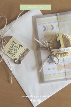 two birthday cards tied up on top of each other with a tag attached to them