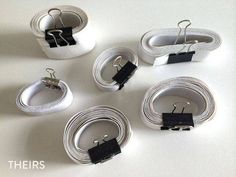 four pairs of white belts with black clips