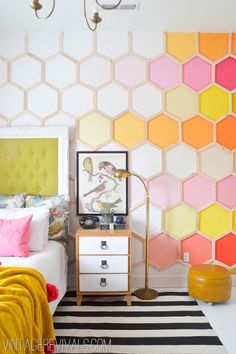 a bedroom with colorful hexagonal tiles on the wall