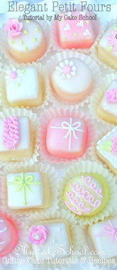 a box filled with lots of decorated cookies on top of a white table covered in pink and yellow frosting