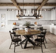 a dining room table with chairs around it