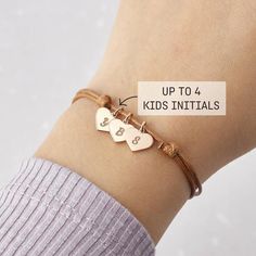 ♥ Children's Initials Leather Bracelet ♥Show your love for mom or grandmom alike with this personalized initial bracelet. With 1 to 5 heart charms engraved with the initials of your choice, this bracelet will be the meaningful gift for her on any special occasion of the year.P R O D U C T ∙ I N F O• Material: Solid 925 Sterling Silver, Coated leather• Finishing: Silver - Gold - Rose Gold• Heart charm dimensions: 3/8" (9.5mm) x 1/3" (8.2mm)H O W • T O • O R D E R• Select your preferred finishing Adjustable Birthstone Bracelets For Birthday, Hypoallergenic May Birthstone Bracelets For Birthday, Emerald Bracelet For Birthday, Adjustable Bracelets For Birthday And Mother's Day, Personalized Sterling Silver Bracelets For May Birthstone, Personalized Sterling Silver Bracelet For May Birthstone, Adjustable Nickel-free Jewelry For Birthday, Adjustable Name Bracelet With Birthstone For Birthday, Personalized May Birthstone Bracelets For Birthday