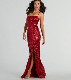 Make a jaw-dropping entrance in the Marisol sequin satin formal dress at black-tie banquets, weddings, or school dances! A square neckline and spaghetti straps accentuate the figure while the lace-up open back adds a touch of drama. The floor-length mermaid silhouette flows into the front slit for movement, showcasing a mesmerizing sequin scroll pattern on luxurious satin fabric. Complete the look with a glam hair accessory, heels, and necklace for a flawless evening!Fit & FeaturesSequin scroll pattern, satin fabric lined with stretchy knitLace-upBack zipper and hook-eye closurePadded bra cupsFront slitMermaid silhouetteRuns true to size Cute Short Prom Dresses, Dresses Long Elegant, Satin Formal Dress, Red Dress Long, Full Tulle Skirt, Senior Prom Dresses, Mermaid Sequin, Long Prom Gowns, Glam Hair