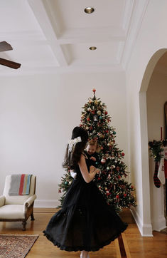 @lauren_paley in the lovely Mirabelle Dress in Black Linen With black ribbon tie straps, a corset bodice, and sweeping ruffle hem the Mirabelle Dress is dramatic, romantic beauty at its best and one of our most popular styles. Made in a lightweight linen with a sateen finish that gives the linen a subtle dressy luster. A showstopper of a dress made for special moments, celebrations, or romantic getaways -- a dress to cherish, wrap in tissue paper and pass down. Photos by@livvieclicks