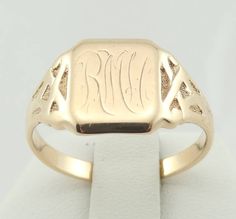 "Rare vintage Early 1900's Ostby and Barton signet ring in solid 14K yellow gold. Mr. Ostby tragically died when the Titanic sank in April 1912. Hand engraved initial \"RM\". Stamped \"O.B.14K\" FREE SHIPPING! Details: 14K Yellow Gold: (as shown in picture) Ring Size: 9 1/2 Total Weight: 4.7 grams FREE domestic shipping by USPS Priority Mail Signature Confirmation and includes insurance. If the item is to be shipped internationally Etsy will calculate postage. Please notify us at purchase if you Classic Yellow Gold Signet Ring With Maker's Mark, Classic Engraved Yellow Gold Ring With Maker's Mark, Classic Yellow Gold Engraved Ring With Maker's Mark, Gold Engraved Ring With Maker's Mark, Collectible, 14k Gold Signet Ring With Maker's Mark As Gift, 14k Gold Engraved Ring With Maker's Mark As Gift, Engraved 14k Gold Signet Ring Collectible, Formal 14k Gold Signet Ring With Hallmarks, 14k Gold Engraved Signet Ring Collectible