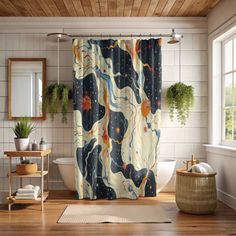 a bathroom with a shower curtain that has an abstract design on it and wood flooring