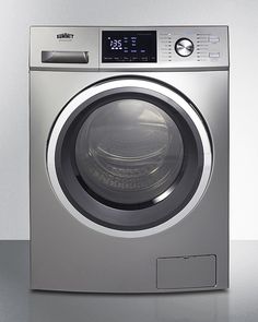 a silver washing machine sitting on top of a counter