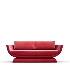 a red couch sitting on top of a white floor