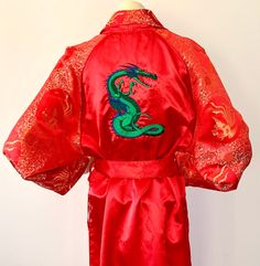 Vintage 1970s 80s Red ASIAN Kimono Robe with Green Dragon  Red Silk* Asian Kimono robe Embroidered Dragon and TEG on Robe Long Length Matching  belt In excellent vintage condition Size One size fits all Small-Medium-Large Women's USA Probably a Small to Medium Men's Measures Bust/Chest up to 44 inches--is simply belted and gathered in for smaller sizes It is shown on a size small mannequin *Not sure if this robe is Silk--no fabric content tags--but it is a least satin Embroidered Dragon, Small Mannequin, Fun Outfits, Japanese Silk, Green Dragon, Silk Robe, Pajama Robe, Red Silk, Vintage 1970s