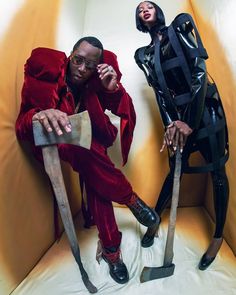 two people sitting on top of a yellow chair