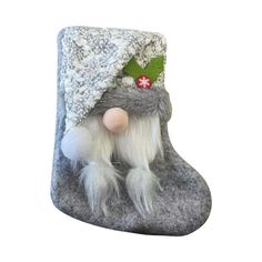 a gray and white christmas stocking with an elf's hat on it, sitting in front of a white background