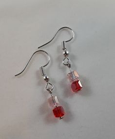 Dangle Earrings Pink and Red Transparent Faceted Cubes are 1.25 inches long. I just love how these beads catch the light and sparkle. They are so beautiful. Beads were purchased new. Trendy Pink Earrings With Dangling Beads, Cute Pink Beaded Dangle Earrings, Handmade Pink Beaded Dangle Earrings, Pink Hypoallergenic Beaded Dangle Earrings, Pink Dangle Earrings With Faceted Beads, Handmade Jewlery, Long I, Earrings Pink, Pink And Red