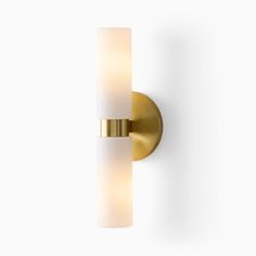 a light that is on the side of a wall mounted fixture with a white glass shade