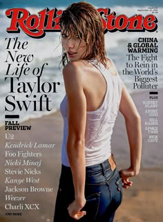 a woman standing on top of a magazine cover with her back turned to the camera