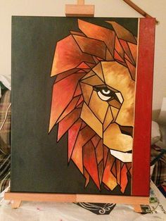 a painting of a lion on a easel