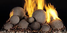 a pile of rocks with fire in the background