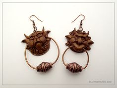 the earrings are made out of wood and have an elephant head on it's ear