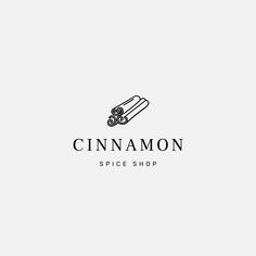 the logo for cinnamon spice shop, which is designed in black and white with an image of