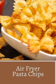 air fryer pasta chips in a white bowl with ketchup on the side